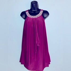NWT- Beautiful fuchsia top made with hand sewn beading.  Size M.